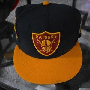 Raiders Black Burgundy and Gold Cap 7 3/8. (724)